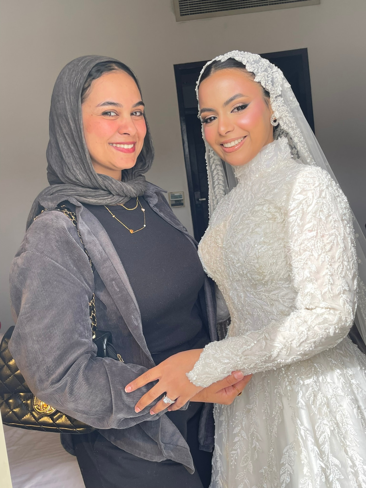 Amira Mostafa, bridal makeup artist, holding a makeup brush