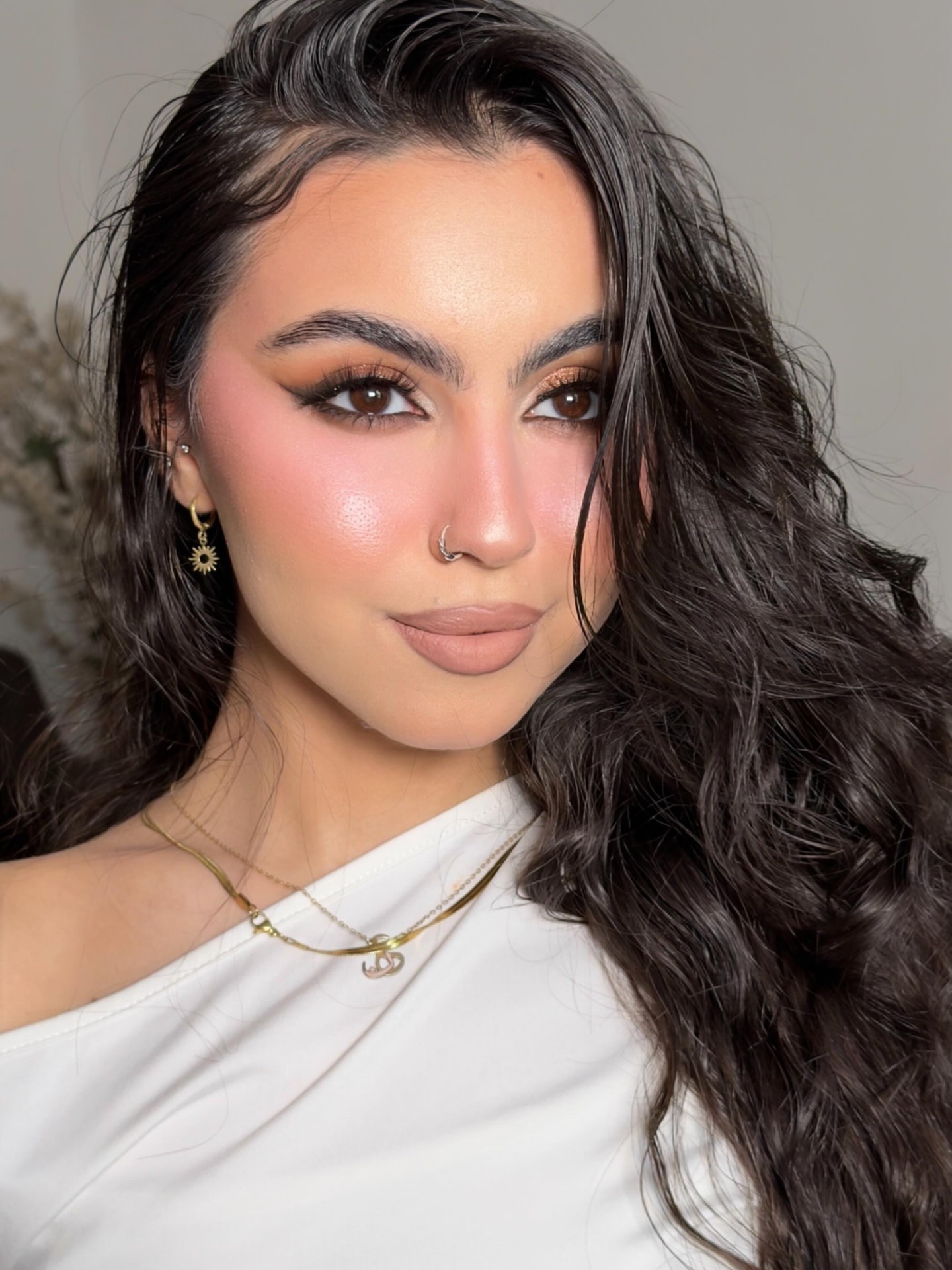 Engagement makeup with copper shimmer eyes and glowing cheeks